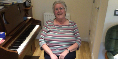 Mary using foot pedal from the COVID Activity Packs provided by Stockport Moving Together