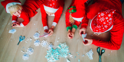 Family making Christmas snowflake crafts